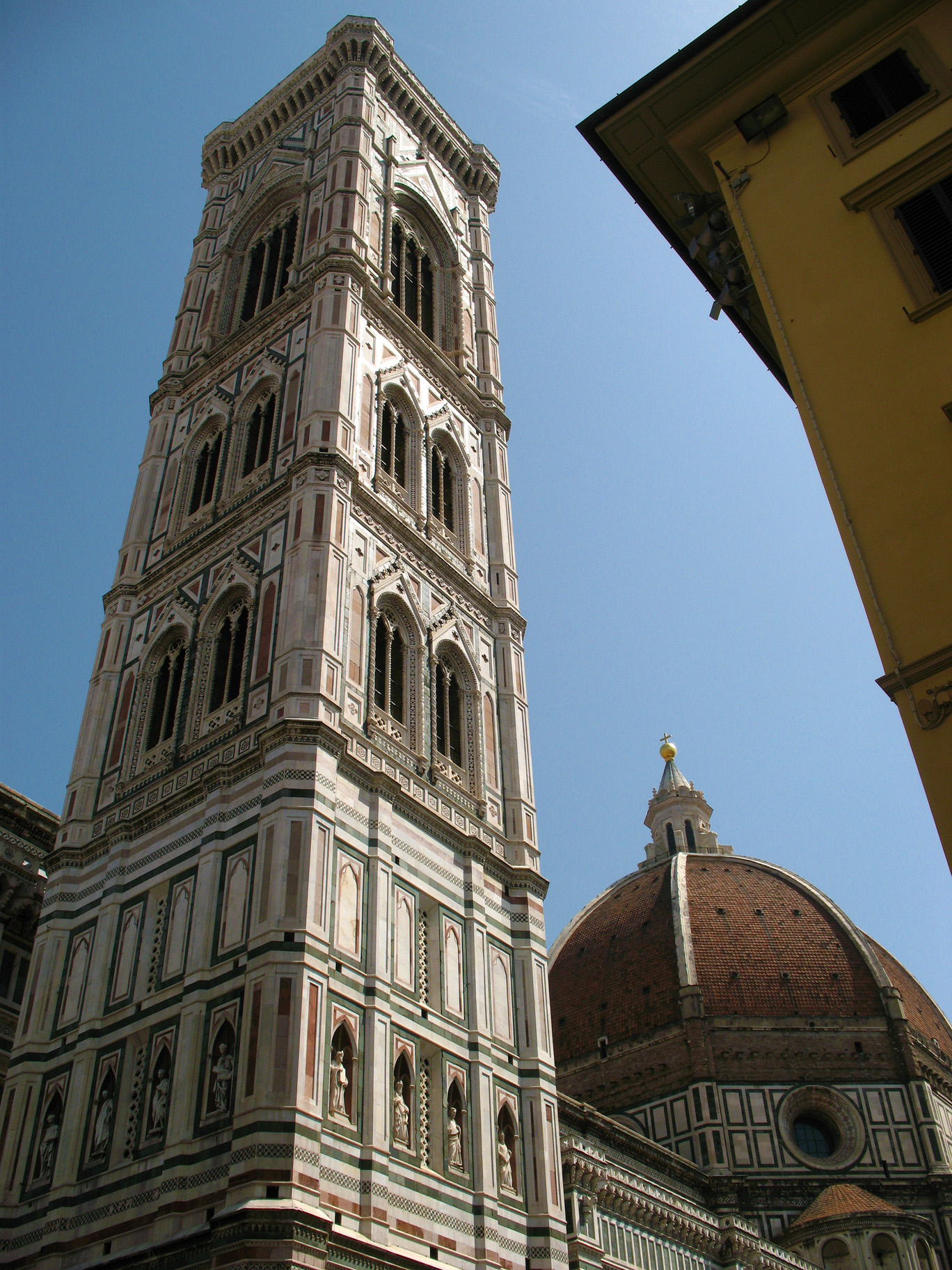 Giotto's campanile and Brunelleschi's dome, decorating the sky.
